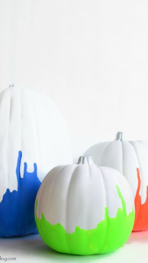 20 Unique No Carve Pumpkin Decorating Ideas: Halloween Fun neon painted dipped pumpkin no carve idea glow in the dark